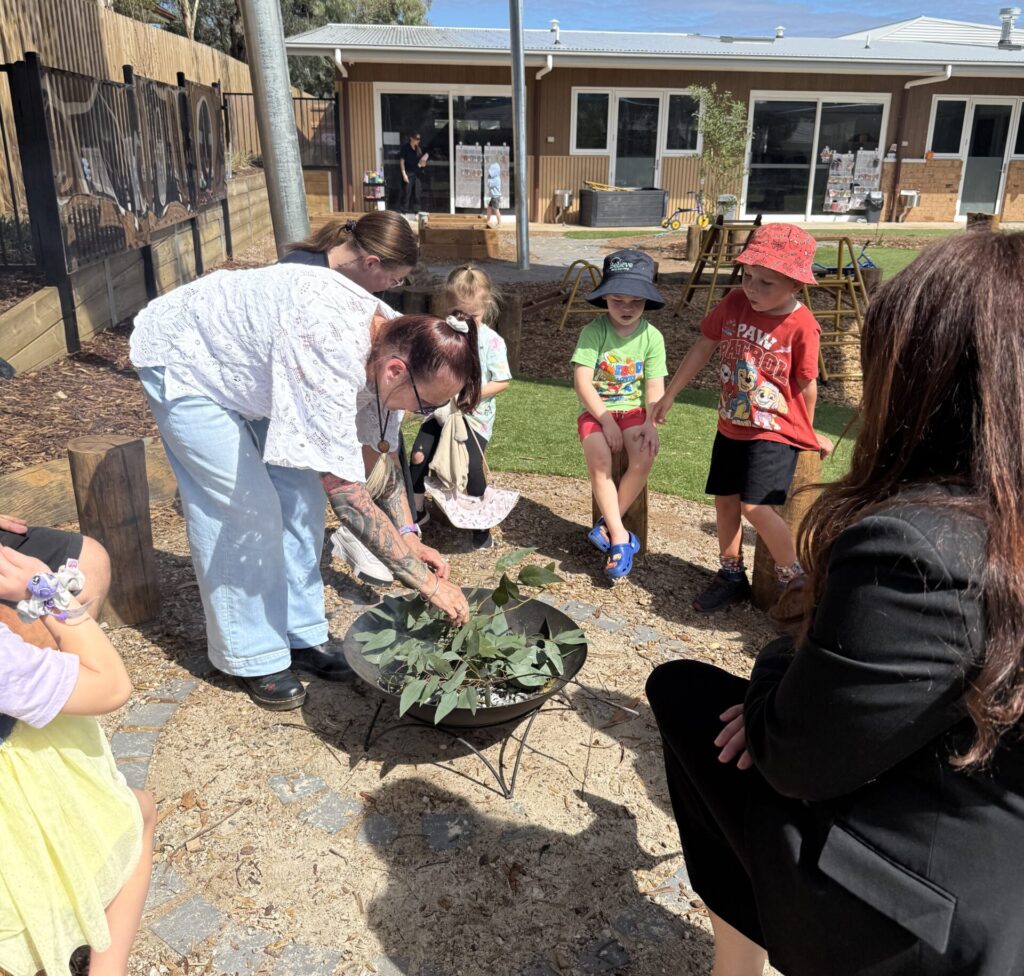 Children and families at the yarning circle Believe Early Learning Eaglehawk